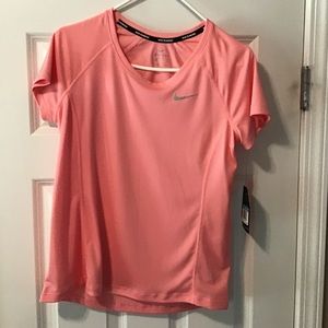 Peach colored Nike Shirt 🍑